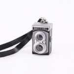 Mini strap camera with wearable portable body design