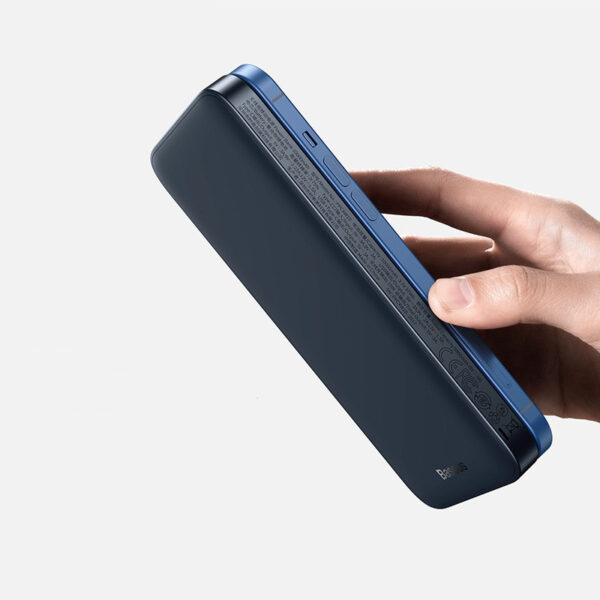 Magnetic wireless power bank attached to the back of a smartphone.